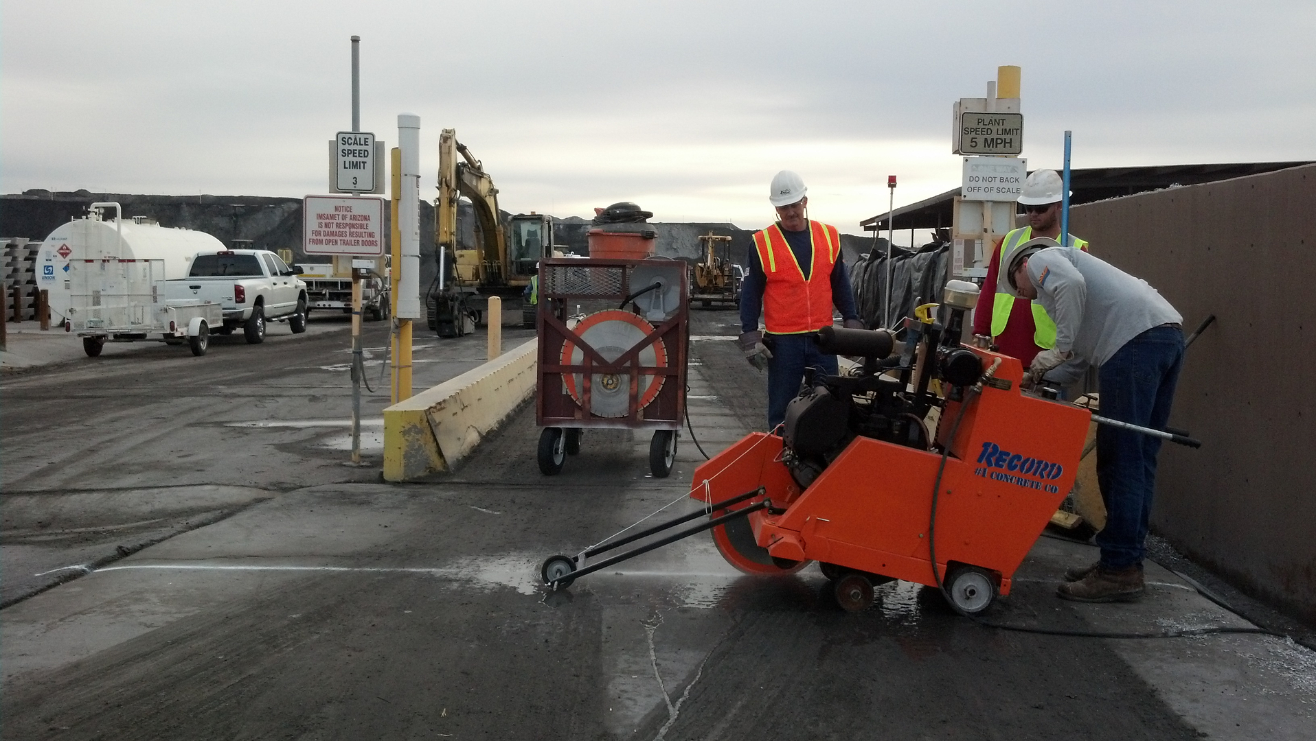 Demolition work with the orange concrete saw